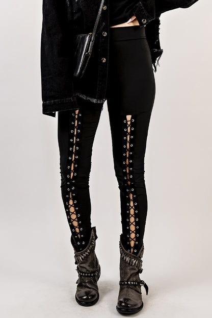 Woman wearing Black Grommet Lace Up Front Leggings in a stylish setting