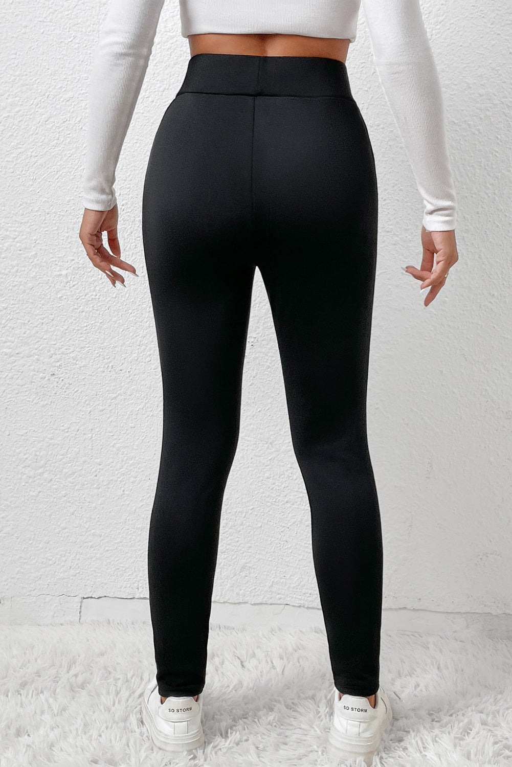 Woman wearing High Waist Fleece Lined Winter Leggings in a cozy winter setting