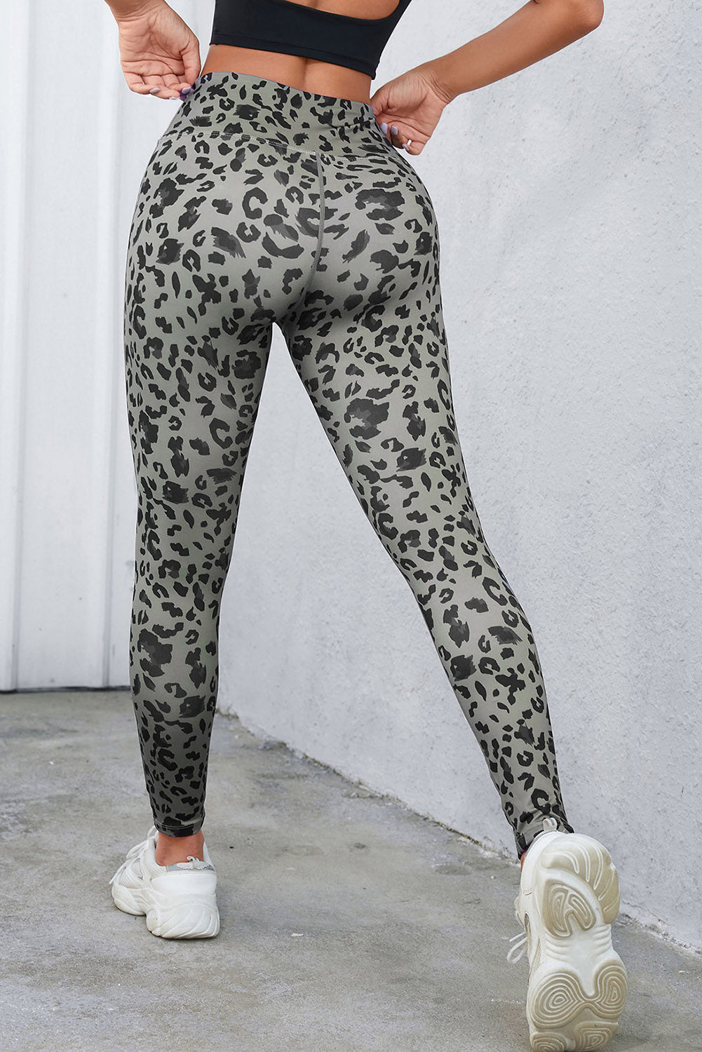 Woman wearing Classic Leopard Print Active Leggings in an urban setting