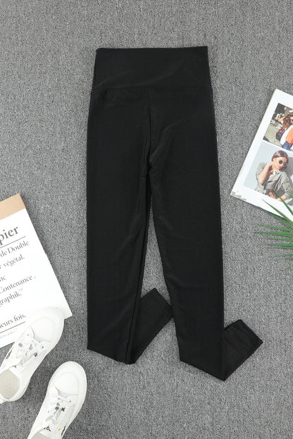 Woman wearing Black High Rise Tight Leggings in a casual setting